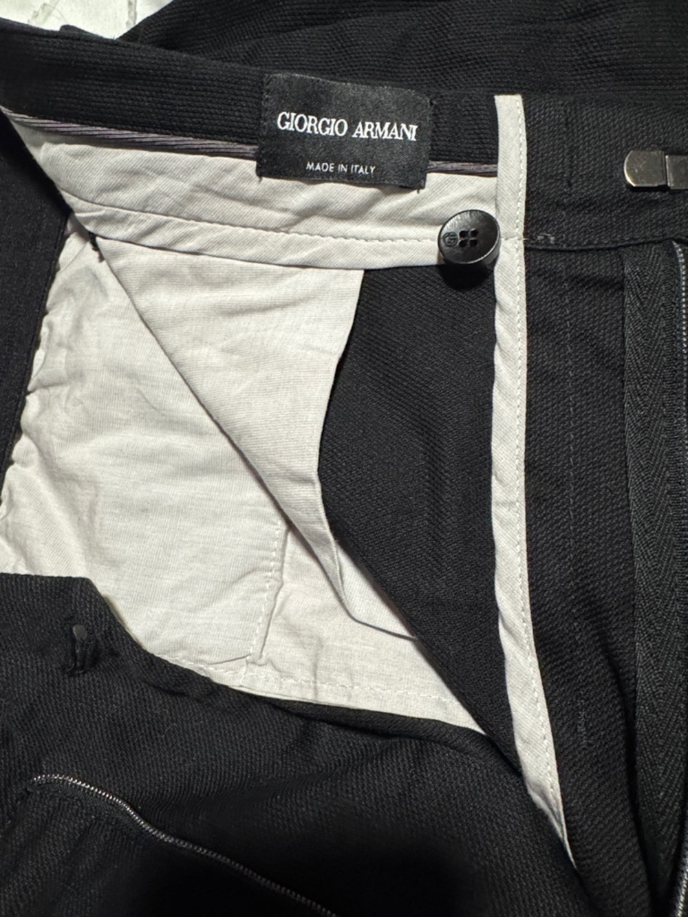 Giorgio Armani black pleated pants.